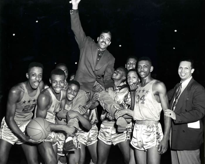 Crispus Attucks celebrates with coach Ray Crowe.